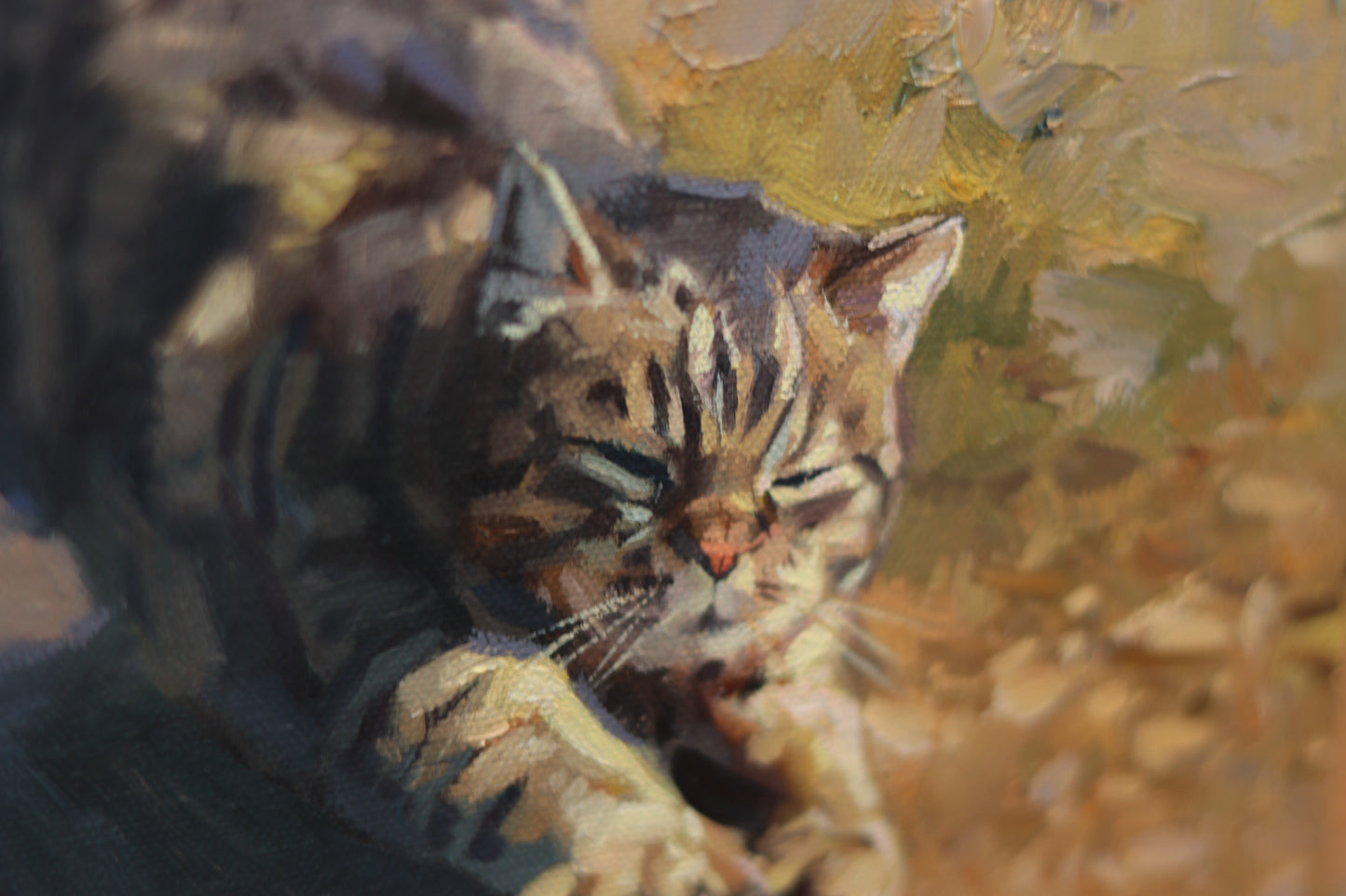 Oil painting of a tabby cat stretching in warm sunlight, with eyes closed and front paws extended. The artwork features expressive brushstrokes and rich textures in tones of gold, brown, and ochre. Canvas size is 6x6 inches.